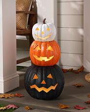 Stacked lit Jack-o'-Lanterns